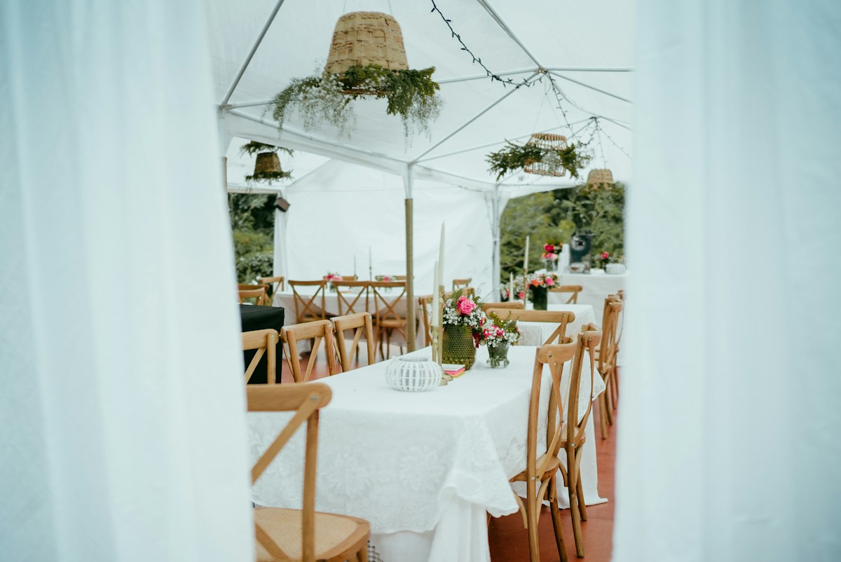 Pink florals and linens on a warmly lit celebration table